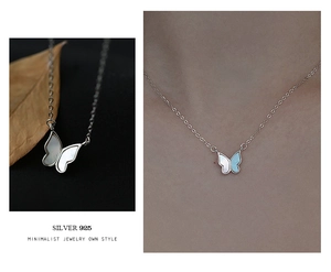 Vue macro détaillée du collier pendentif papillon en argent S925 avec nacre blanche