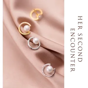 Elegant semi-circular S925 silver pearl stud earrings with sparkling diamonds on silk