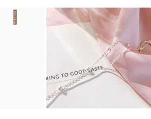 Detailed view of minimalist double-layered S925 silver bracelet with delicate metal beads