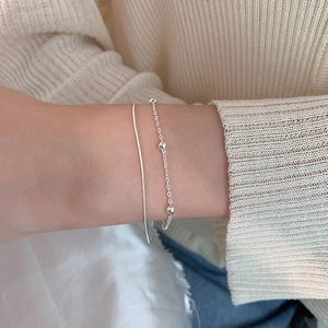 Minimalist silver double-layered bracelet with small beads and snake bone chain for women