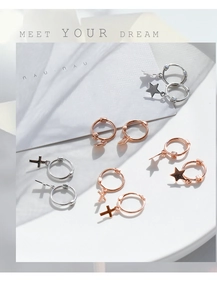 Detailed close-up of 925 silver star and cross pendant hoop earrings in silver and rose gold
