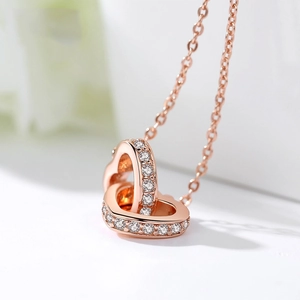 Elegant rose gold interlocking heart necklace with zircon stones on a fine chain