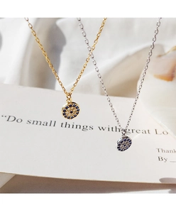 Detailed view of gold and silver S925 Evil Eye necklaces with blue cubic zirconia