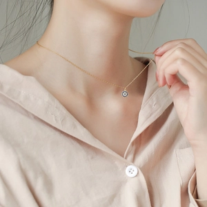Minimalist S925 silver evil eye necklace with blue zircon pendant on a gold chain