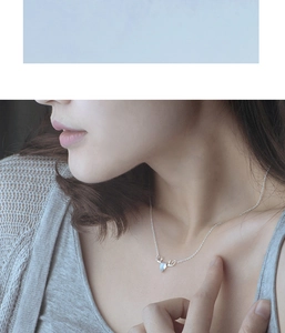 Close-up of S925 sterling silver elk antler necklace featuring a blue moonstone pendant