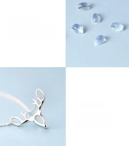 Detail of s925 silver elk necklace featuring moonstone inlay and cabochon cut design