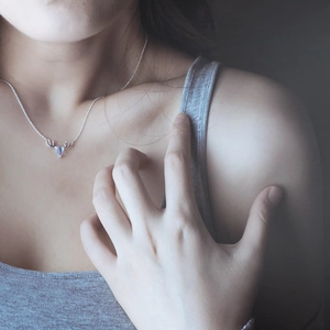 S925 silver elk horn necklace with moonstone pendant on female model neck