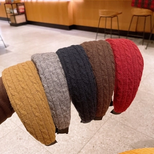 Thick knitted headband with twist pattern in various colors for high cranial top look