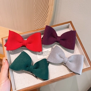 Set of 4 wool felt bow hair clips in red, purple, green and grey with metal duckbill clips