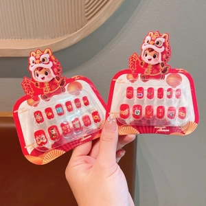 Reusable red press-on nails with cartoon lion dance motifs and Chinese lucky symbols