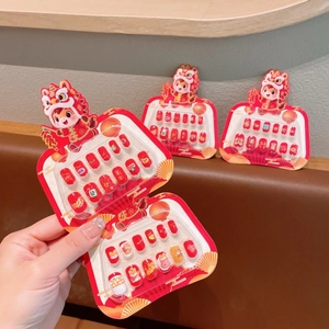 Kids reusable press-on nail kit featuring Chinese New Year Dragon and Lion patterns
