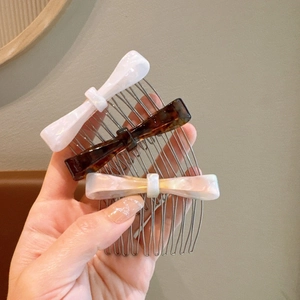 Leopard pattern acetate bow hair comb set in white, tortoise brown, and pearly pink finishes