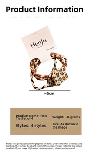 Detail of four durable black and white checkered hair ties on branded card packaging