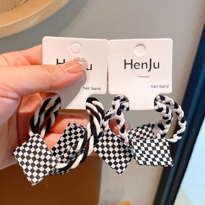 Checkered hair bands set with black and white elastic spiral ropes and small square charms