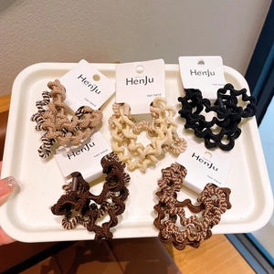 Five-pack wavy high-elasticity hair ties in milk tea tones on a white display tray