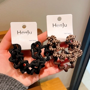 Close-up of high elasticity wave braided hair bands in black and brown milk tea colors