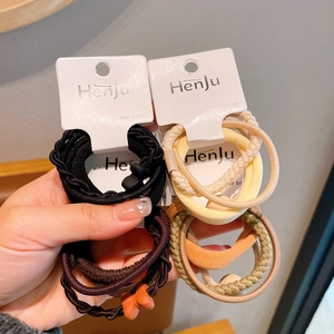 Set of 4 high elasticity hair bands in assorted dark and warm colors with card packaging
