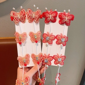Set de pinces à cheveux papillon rouge avec pompons pour filles accessoires de nouvel an