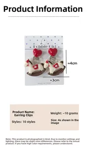 Detail view of heart and rocking horse clip-on earrings with 4x3cm size specs