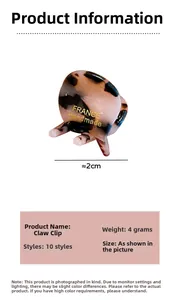 Detail view of a 2cm pink tortoiseshell hair claw clip with France Handmade gold text