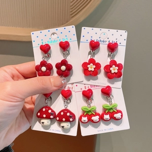 Selection of cute red resin cartoon ear clips for girls including flowers and mushrooms