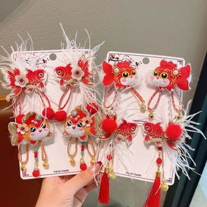Exquisite handmade Chinese New Year fish hair clips with embroidery and red feathers