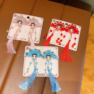 Three Chinese opera face mask hair clips with long tassels and crystal pearl accents