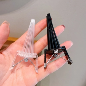 Hair root volumizing clips in black and transparent colors for styling and lifting hair