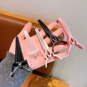 Five assorted colors of volumizing hair root clips and duckbill hair pins for women styling