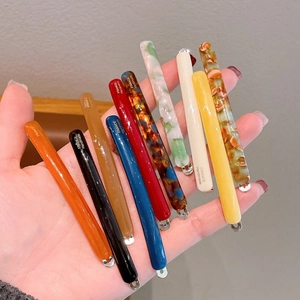 Long acetate hair clips in ten colors featuring a French handmade minimalist design