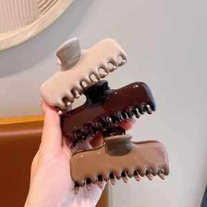Three-piece set of large acrylic hair claws in glossy beige, coffee and caramel brown