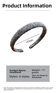 Detail view of a grey knitted headband featuring handmade label and 11cm diameter spec