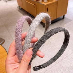 Three-piece set of fluffy knit headbands in purple, light gray, and charcoal gray