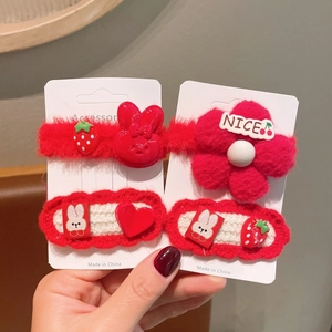 Red knit bow hair clips and strawberry fur balls set for girls in festive New Year style