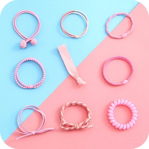 Close-up of 9-piece pink hair ties set showing elastic textures and cute ribbon details