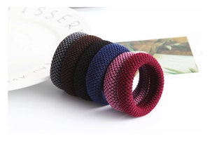 Close-up of durable thick elastic hair ties in a multi-color knitted set for women