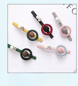 Detailed set of geometric acetate hair clips with fabric wrap, pearls, and rhinestones