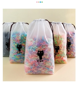 Detail view of colorful elastic hair bands in frosted drawstring bags with cat icon