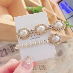 Detail of Korean style hair clips with pearls and rhinestones on gold alloy base