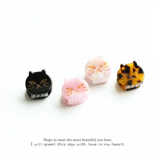 Mini cat hair claws made of acetate fiber in four colors with gold facial details