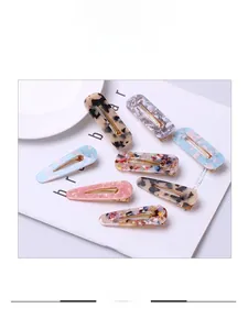 Detailed assortment of acetate hair clips with leopard print and marble patterns