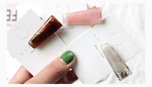 Close-up of tortoise shell, pink and marble acrylic hair clips on a display card