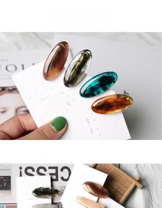 Detailed macro view of retro oval resin hair clips in various tortoise shell amber colors