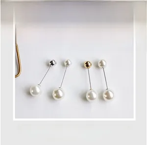 Detail view of pearl brooches with secure locking design and gold silver finish