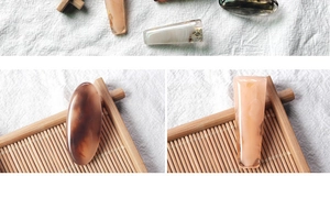 Close-up of vintage tortoiseshell resin hair clips with elegant marble textures