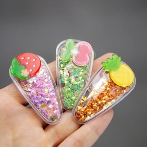 Three-piece set of colorful fruit sequin hair clips featuring strawberry cherry and pineapple