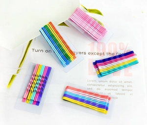 Detail of colorful matte snap hair clips arranged on a transparent display card