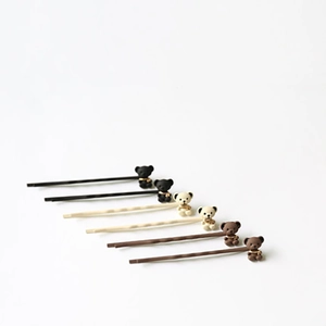 Barrettes panda mignonnes en noir, crème et marron avec texture douce floquée