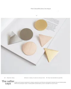 Close-up of minimalist geometric alloy hair clips in matte gold and brushed silver colors