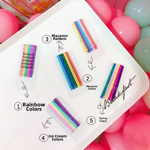 Detailed macro view of colorful candy-colored metal hairpins in a white tray display